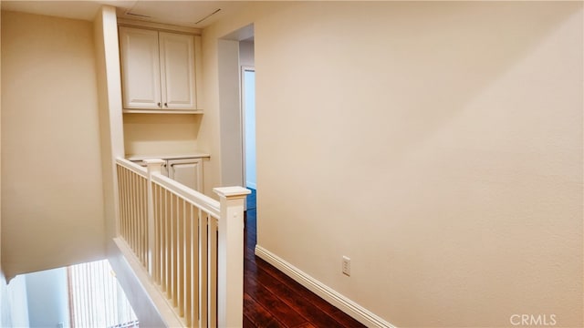 staircase with hardwood / wood-style flooring