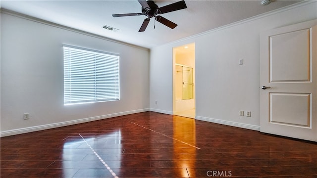 spare room featuring dark hardwood / wood-style flooring, crown molding, and ceiling fan