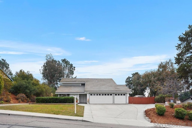 view of front facade with a garage and a front yard