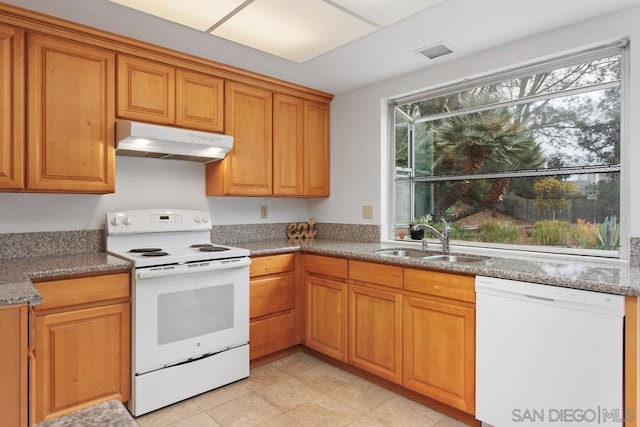 kitchen with sink and white appliances