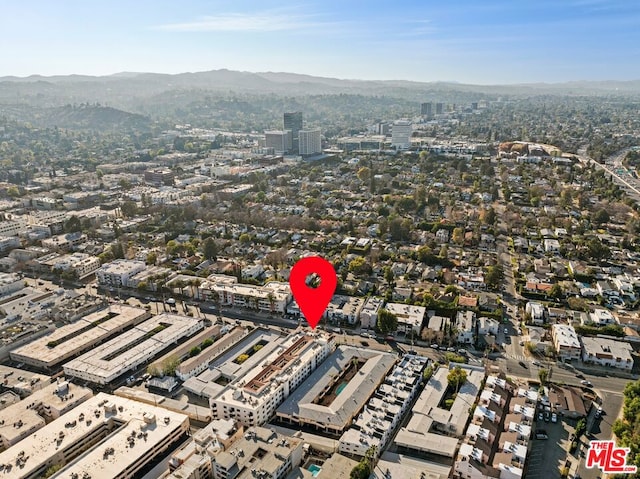 birds eye view of property with a mountain view