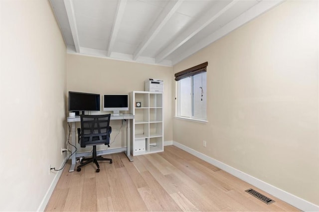 office area featuring hardwood / wood-style flooring and beamed ceiling