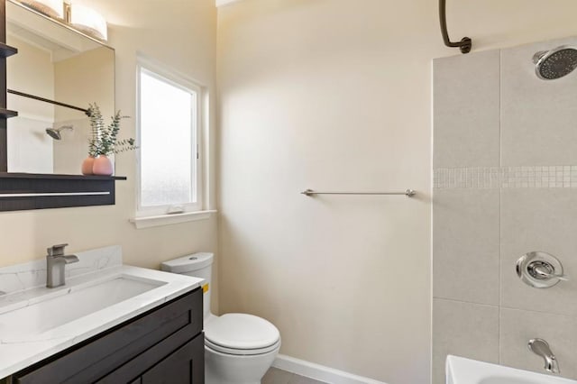 full bathroom with vanity, toilet, and tiled shower / bath combo