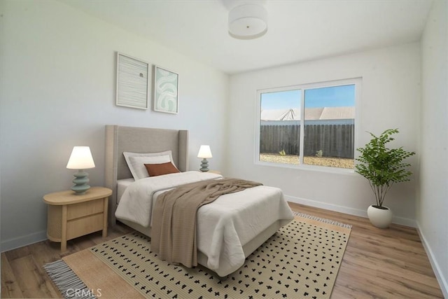 bedroom with light hardwood / wood-style floors