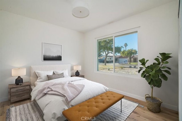 bedroom with light wood-type flooring