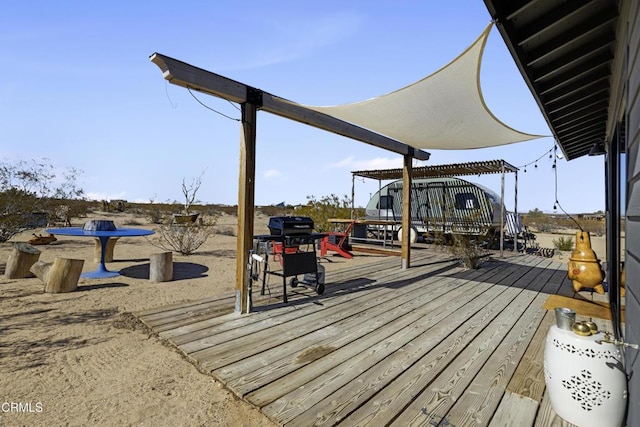 wooden terrace with a pergola