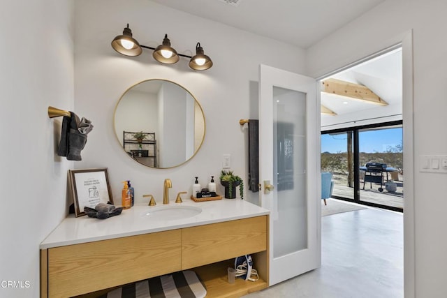 bathroom featuring vanity and concrete floors