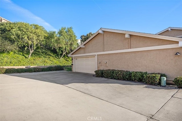 view of property exterior with a garage