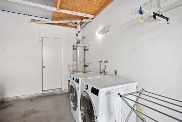 laundry room with washer and clothes dryer and gas water heater