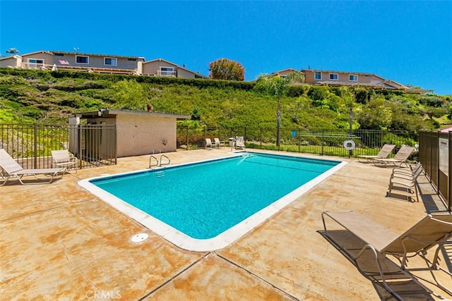 view of swimming pool with a patio area