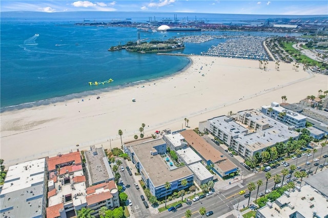 bird's eye view with a water view and a view of the beach