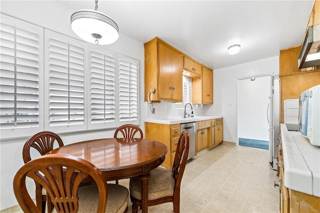 kitchen with sink, backsplash, and stainless steel appliances