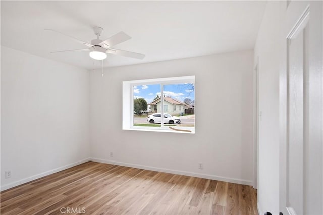 spare room with ceiling fan and light hardwood / wood-style floors