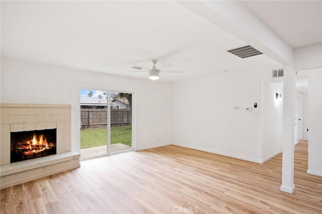 unfurnished living room with ceiling fan and light wood-type flooring