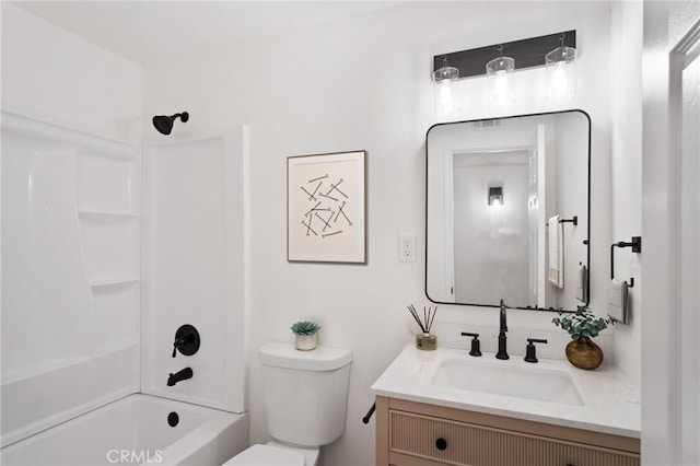 full bathroom with vanity, toilet, and  shower combination