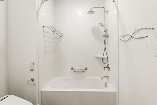 bathroom with shower / bathtub combination and toilet