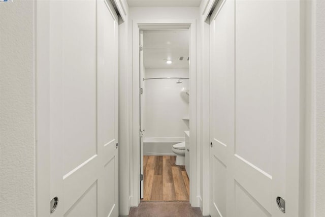 corridor with dark wood-type flooring