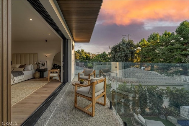 view of balcony at dusk