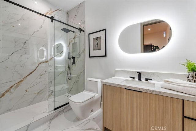 bathroom with vanity, a shower with shower door, and toilet