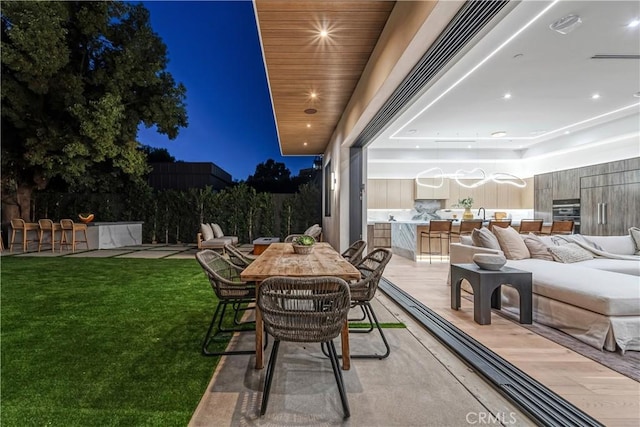 view of patio featuring an outdoor hangout area and an outdoor bar