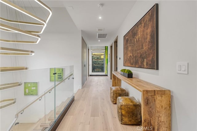 hall with light hardwood / wood-style flooring