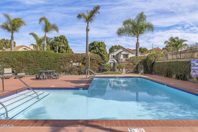 view of pool featuring a patio