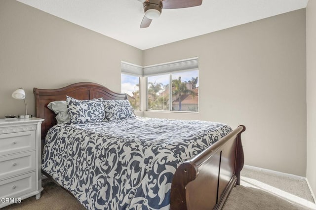 bedroom featuring ceiling fan and light colored carpet