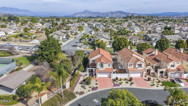 birds eye view of property featuring a mountain view