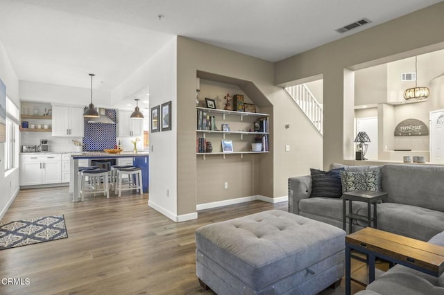 living room with dark hardwood / wood-style floors