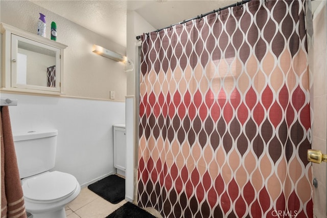 bathroom with tile patterned floors and toilet