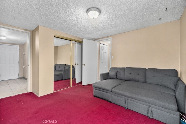 living room featuring light colored carpet and a textured ceiling