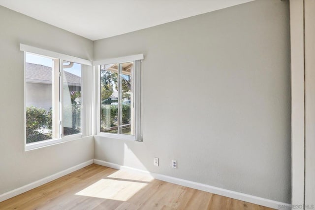 spare room featuring light hardwood / wood-style flooring