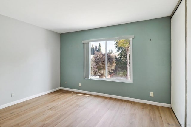 spare room with light hardwood / wood-style floors