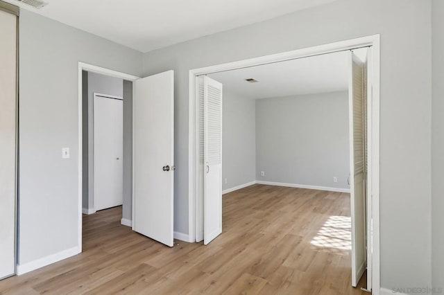 unfurnished bedroom with light hardwood / wood-style floors