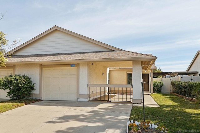 view of front of house featuring a garage and a front yard