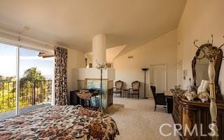 carpeted bedroom featuring lofted ceiling