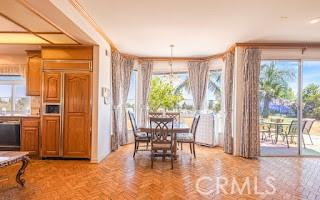 dining space featuring light parquet flooring and a wealth of natural light