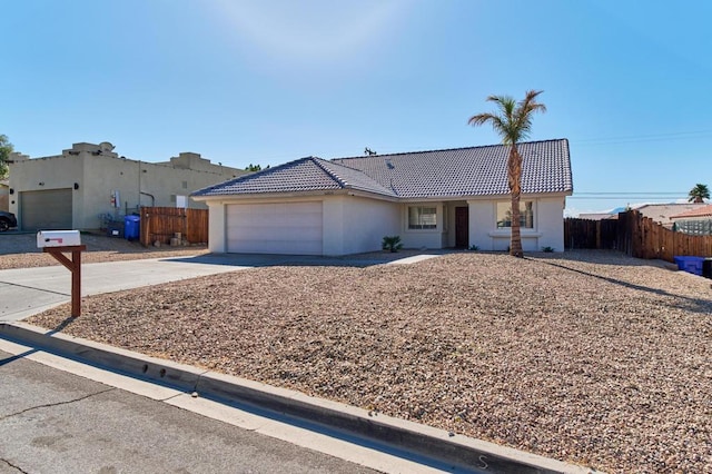 single story home with a garage