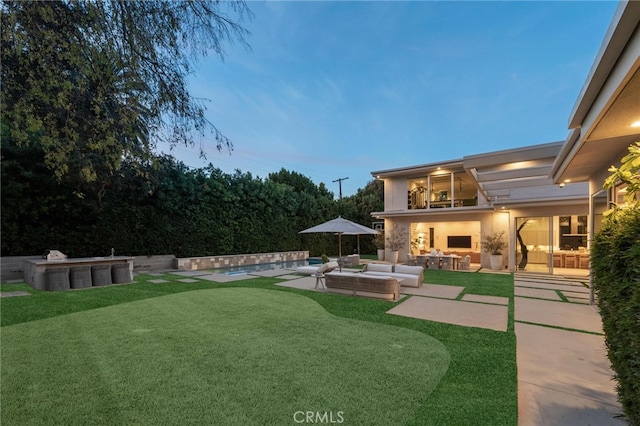 4727 Alonzo Ave, Encino, CA 91316 - yard at dusk with outdoor lounge area, a swimming pool, and a patio area