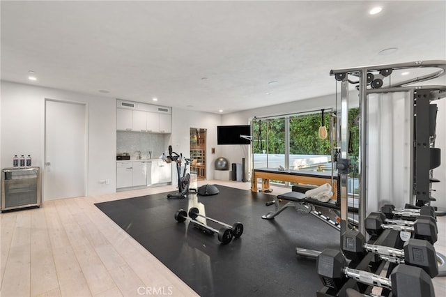 4727 Alonzo Ave, Encino, CA 91316 - workout area with wine cooler and light hardwood / wood-style flooring