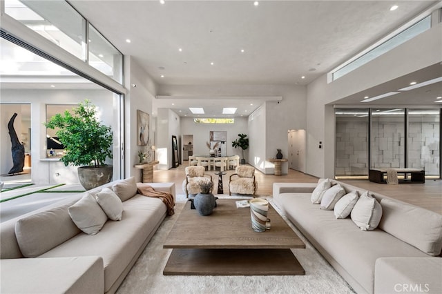 4727 Alonzo Ave, Encino, CA 91316 - living room featuring a healthy amount of sunlight and light wood-type flooring