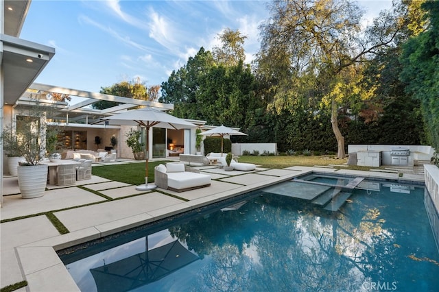 4727 Alonzo Ave, Encino, CA 91316 - view of swimming pool featuring an outdoor living space, a patio, and an outdoor kitchen