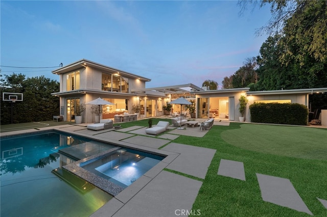 4727 Alonzo Ave, Encino, CA 91316 - back house at dusk with area for grilling, a swimming pool with hot tub, outdoor lounge area, and a patio