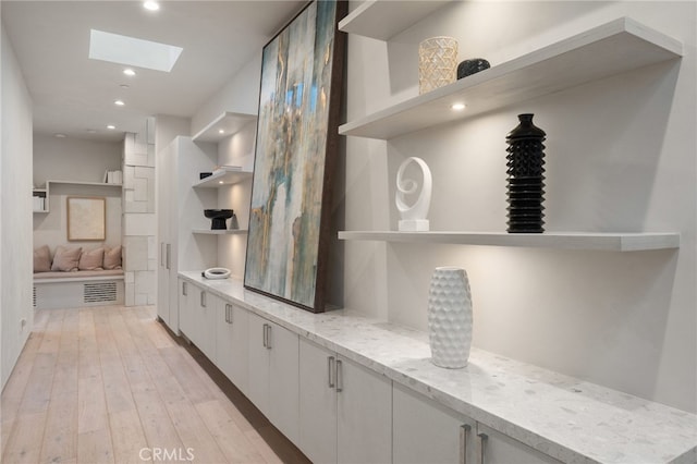 4727 Alonzo Ave, Encino, CA 91316 - mudroom with light wood-type flooring and a skylight