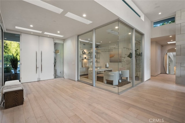 4727 Alonzo Ave, Encino, CA 91316 - wine room with a skylight, expansive windows, and light wood-type flooring