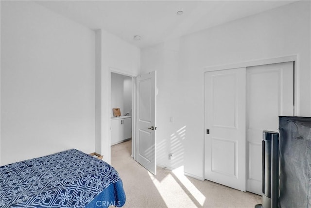 carpeted bedroom featuring a closet