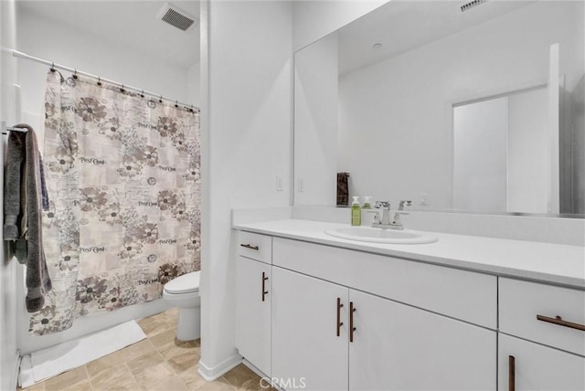 bathroom with a shower with curtain, vanity, and toilet