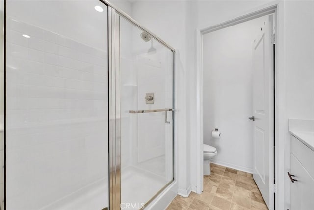 bathroom featuring walk in shower and toilet