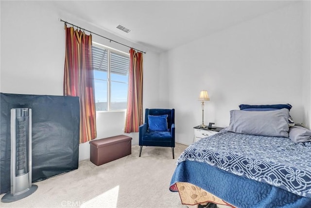 bedroom with light colored carpet