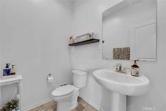 bathroom featuring sink and toilet